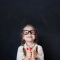 ÃÂ¡urious Girl in Glasses Showing Hands with Thumb Up and Smiling